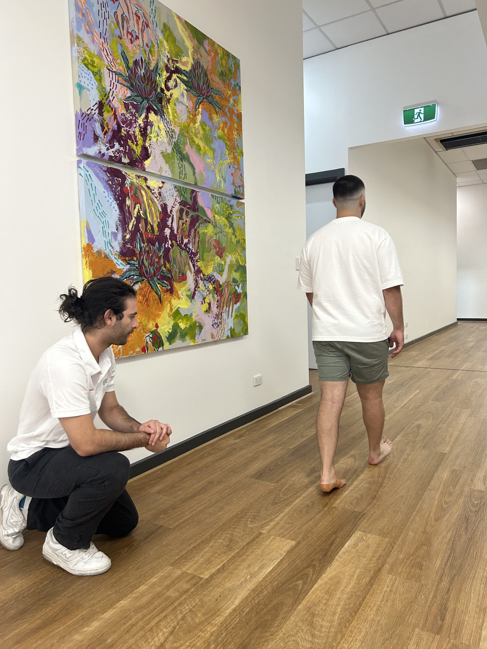 A podiatrist observes his patient's gait during a consultation at Inertia Health Group's Port Adelaide clinic