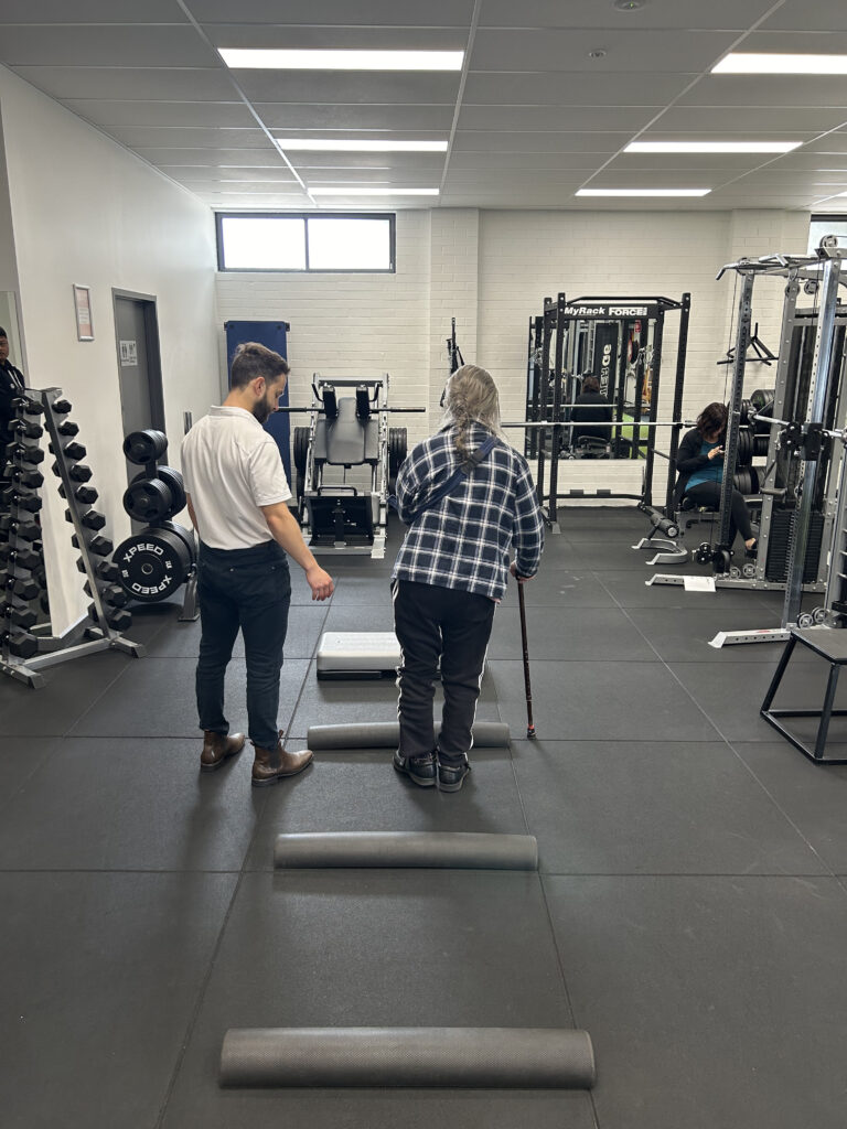 A man having his physiotherapy session in a gym environment