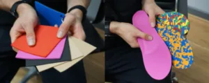 A podiatry professional presenting a selection of materials used in the construction of custom foot orthotics.
