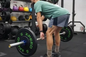 Person lifting weights while working muscles and improving flexibility